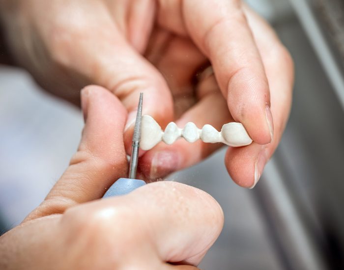 dental-technician-molding-teeth-2021-08-26-17-52-15-utc-min